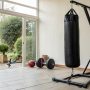 Everlast punch bag with stand for the ultimate home gym boxing setup, ideal for training and fitness at home.