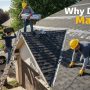 Roofing contractor inspecting residential roof before project