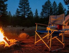 Affordable portable camping chair setup at outdoor campsite with campfire