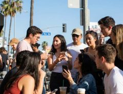 Hollywood fans discussing celebrity gossip in Los Angeles