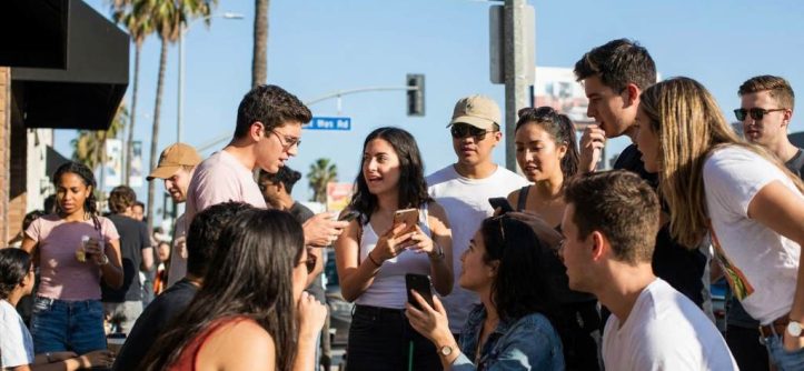 Hollywood fans discussing celebrity gossip in Los Angeles