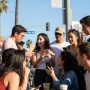 Hollywood fans discussing celebrity gossip in Los Angeles