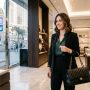 Woman holding a luxury designer handbag inside an upscale boutique on the Las Vegas Strip in Nevada